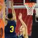 Michigan sophomore Trey Burke takes a shot  over freshman Mitch McGary during an open practice at the Georgia Dome in Atlanta on Friday, April 5, 2015. Melanie Maxwell I AnnArbor.com